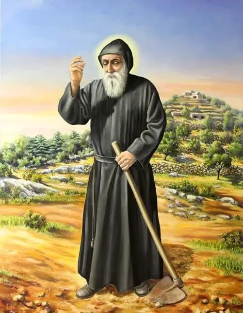 San Charbel trabajando la tierra en Annaya, con la azada y la ermita al fondo